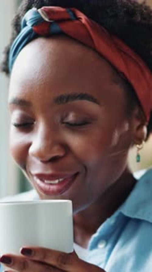 Woman Smiling and Holding Mug Indoors