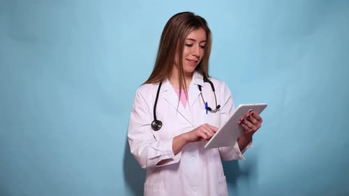 Female Doctor Using Tablet for Medical Research