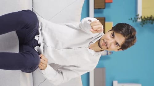 Vertical video of Happy man dancing to the camera.