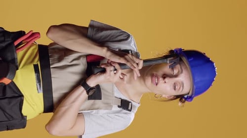 Vertical Video Portrait of Powerful Female Builder Having Headache