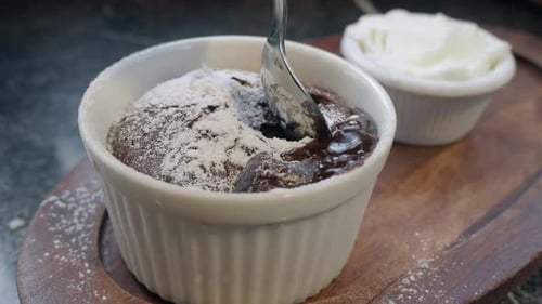Chocolate Lava Cake with Molten Center Being Scooped