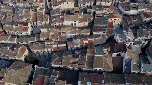 4K Slow Motion Aerial Drone Shot Flying Over a Medieval Village in Spain with Narrow Streets and Old