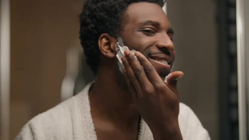Smiling Man Applying Shaving Cream to Face