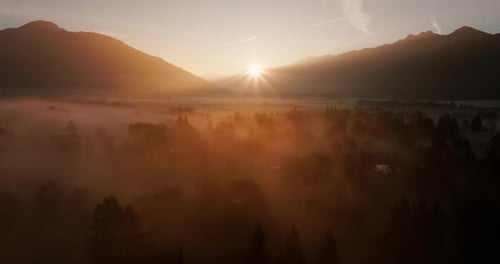 Majestic Sunrise Over Misty Mountains and Valleys