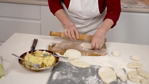 Hands in Flour Close Up Woman Holding Rolling Pin Flattening Dough for Home Made Pastry or Dumplings