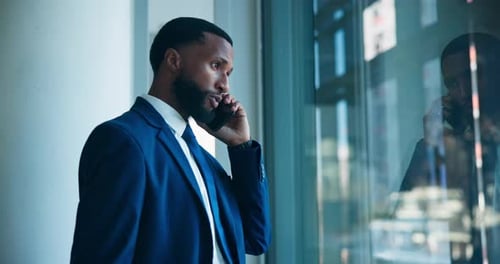 Communication, business or man with phone call by window, negotiation or contract for company