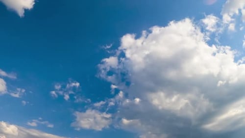 Amazing azure skies with white clouds slowly floating in the air