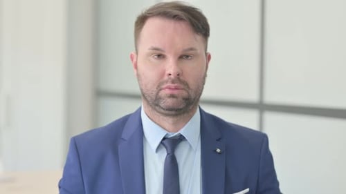 Man in Suit Looking at Camera