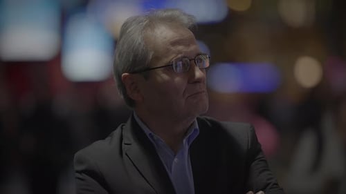 Contemplative Businessman in City at Night