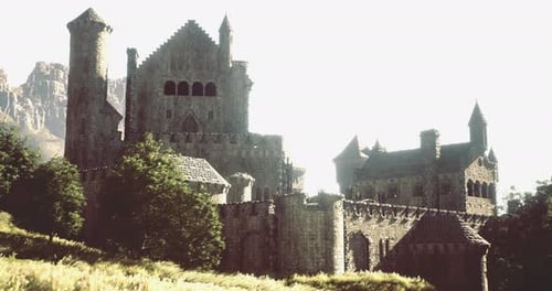 Ancient Castle Sits Majestically on a Hill Surrounded By Lush Greenery