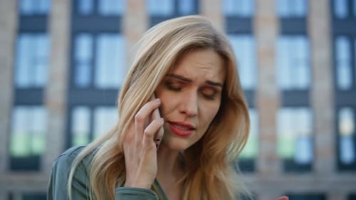 Troubled Businesswoman Calling Cellphone Expressing Dissatisfying Street Closeup