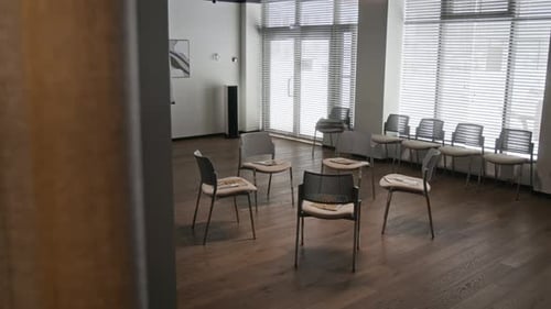 Empty Support Group Therapy Room with Chairs in Circle