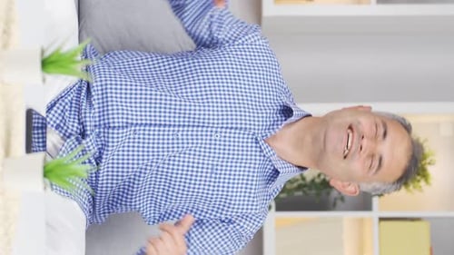 Vertical video of Happy dancing man full of joy.
