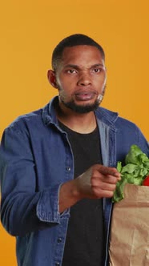 Vertical Video African American Secretive Guy Doing Mute Hush Gesture with Finger Over Lips