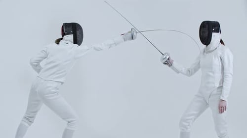 Fencing Two Young Women Fencers Training the Fight