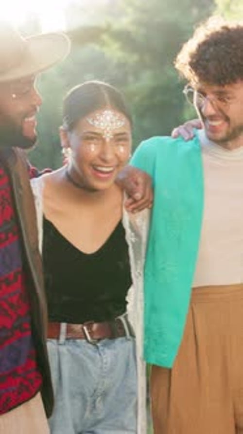 Face, happy and people or friends at festival with hug, celebration and party in artistic fashion