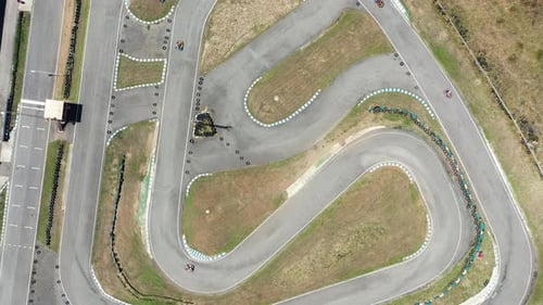 Birds Eye View of Karts Racing on Track