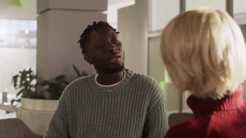 Diverse Colleagues Talking in Bright Modern Office