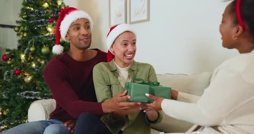 Cheerful Friends Exchange Christmas Gifts at Home
