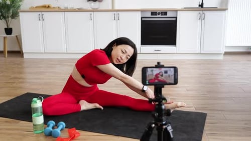 Woman Stretching on Yoga Mat in Home Setting
