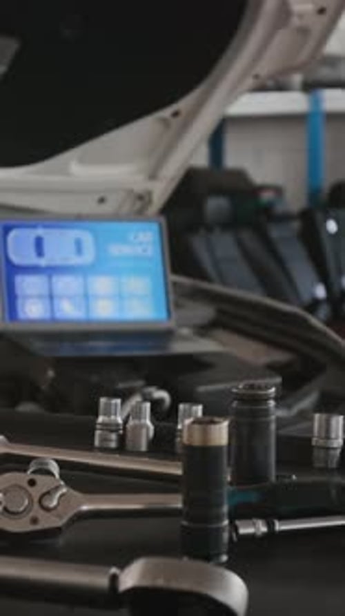 Auto Repair Tools with Laptop Computer in Garage
