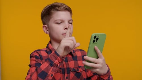 Boy Using Smartphone With Red Plaid Shirt
