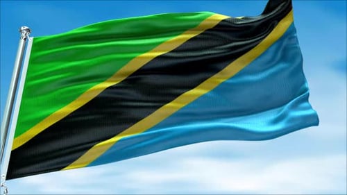 Waving Tanzania National Flag Against Clear Blue Sky