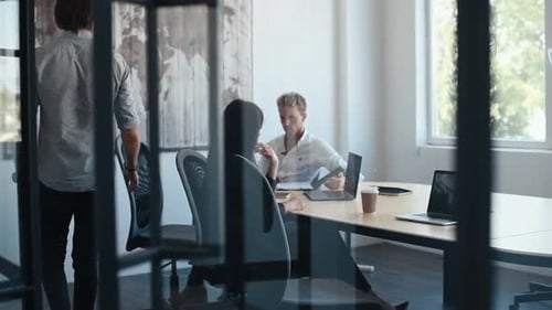 Team Collaborates in Modern Office Meeting Room