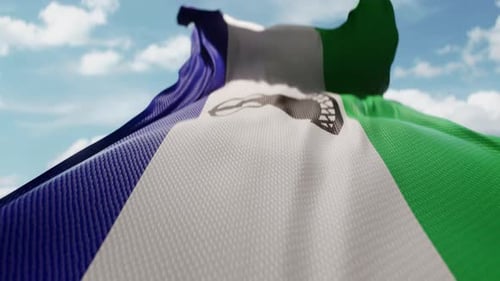 Wavy Flag of Lesotho Blowing in the Wind in Slow Motion Waving Colorful Lesotho Flag Team Symbol