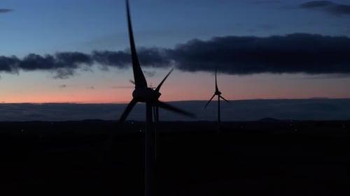 Wind Farm Turbine Operating at Night Generating Renewable Power