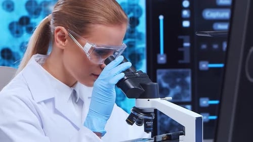 Focused Woman Uses Microscope in Modern Laboratory