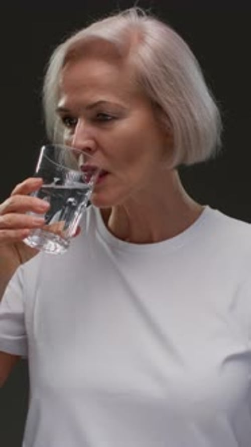 Old Woman Drinking Water Smile Mature Woman for Health Vision or Wellness Beverage Happy Person