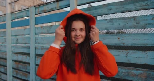 Young Girl Wearing Hood in Slow Motion