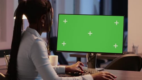 Company Worker Analyzing Greenscreen Display on Monitor