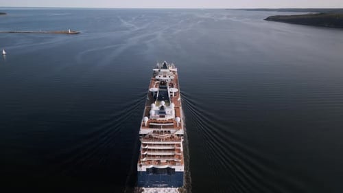 Drone Shot of a Passenger Cruise Ship Sailing Out of the Harbor in Open Ocean