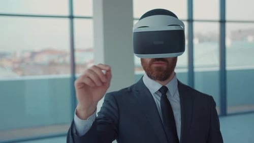 Serious Attractive Man Making Gestures When Wearing Virtual Reality Goggles Empty Building Beard