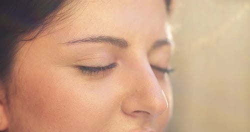 Close Up of Pretty Female Face with Dark Brown Eyes Opening Outdoors Adult Woman Bathing in Sunlight