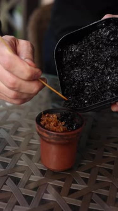 preparing a hookah at the bar