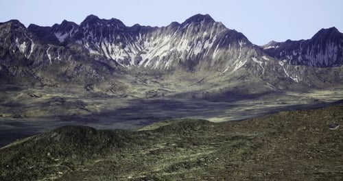 Majestic Mountain Range with Snow Capped Peaks During Bright Daylight
