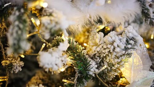 Close Up View of Beautiful Artificial Christmas Tree with Toys and Multilights Prelit