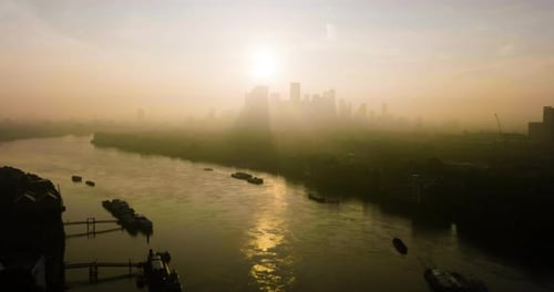 Sun Rays Glow Through City Skyline On Summer Morning Epic Aerial Cinematic Shot