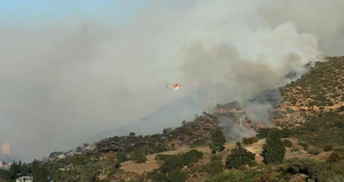 Helicopters Battle Wildfire in Malibu and Pacific Palisades Area