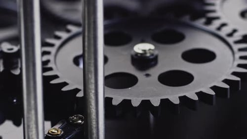 Rotating Gears Turning in Machinery Clockwork System