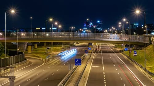 Nighttime Urban Rush: Clear Skies Over Warsaw's Mokotow District