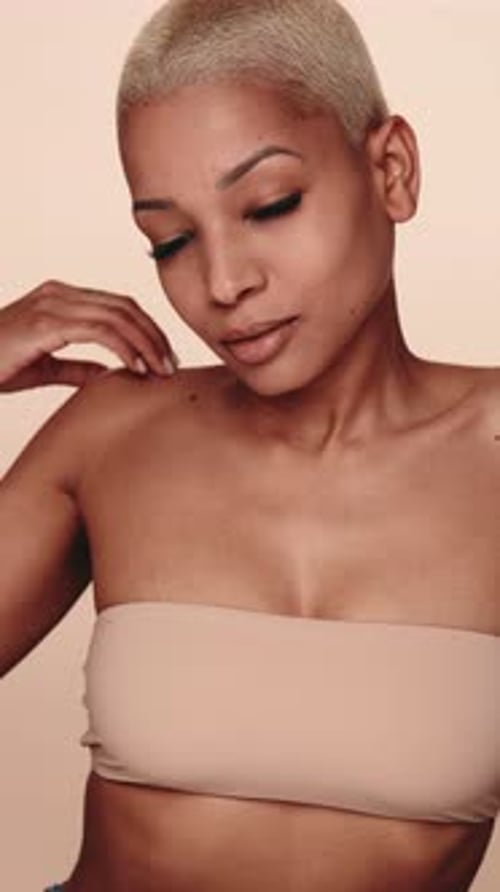 Woman Posing Sensually, Touching Face and Neck