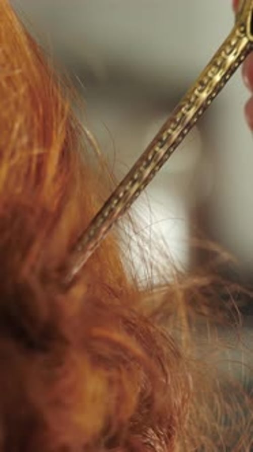 Hair Pin Placed in Red Curly Hair