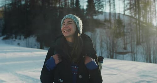 Portrait of Female Tourist with a Backpack Enjoying her Walk While Watching the Beaut