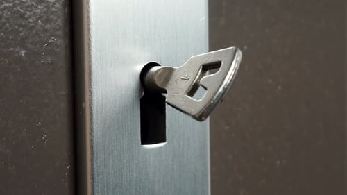 Key Hole In Old Wooden Door With Key