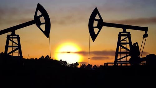Oil Industry Equipment, Drilling Derricks Silhouette From Oil Field At Sunset With Dramatic Sky
