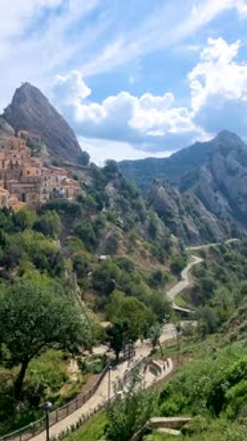 Mountain Landscape with Winding Road and Quaint Village Nestled in the Hills Castelmezzano Italy